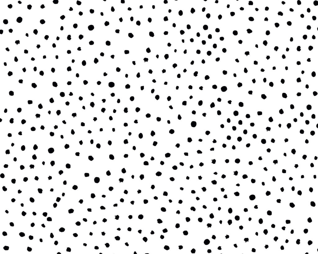 Um fundo preto e branco com pequenos pontos pretos Um fundo preto e branco com pequenos pontos pretos