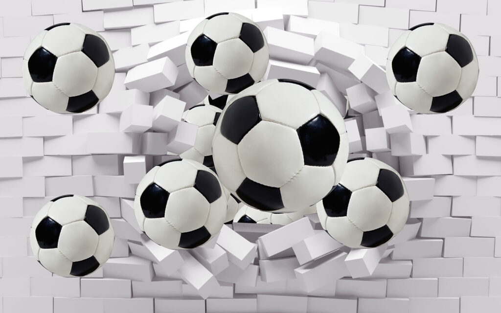 Grupo de bolas de futebol a voar sobre um muro Grupo de bolas de futebol a voar sobre um muro
