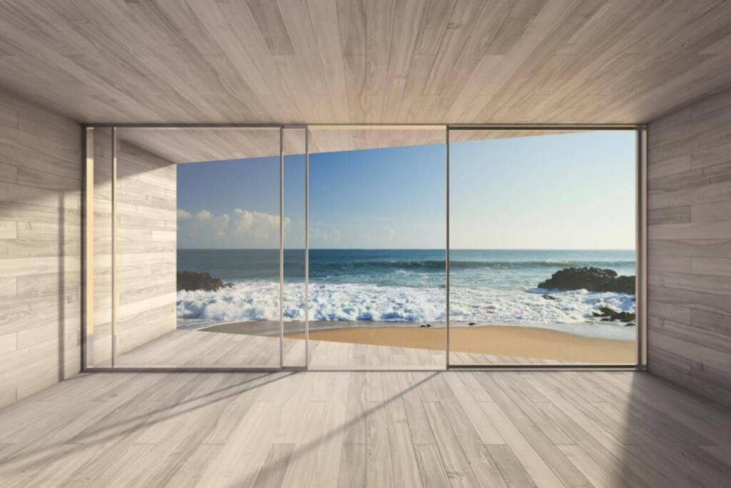 Quarto com grandes portas de vidro e vista para a praia Quarto com grandes portas de vidro e vista para a praia