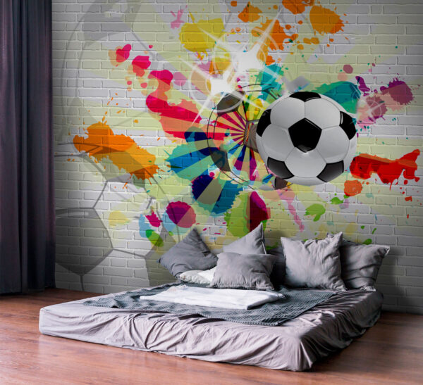 Bola de futebol numa parede de tijolo Bola de futebol numa parede de tijolo