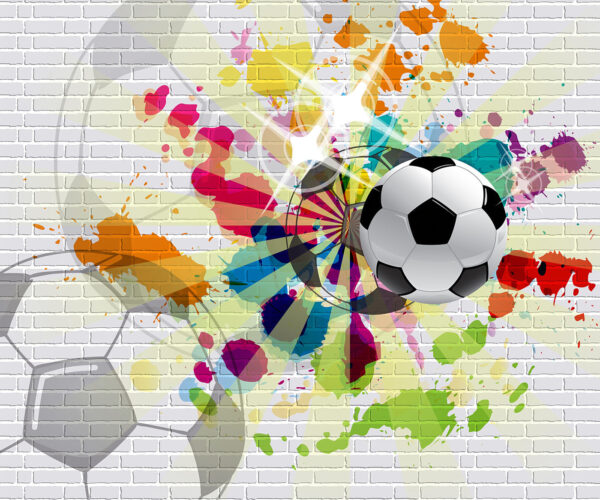 Bola de futebol numa parede de tijolo Bola de futebol numa parede de tijolo