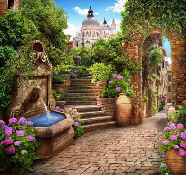 Caminho de pedra com uma fonte, escadas e flores Caminho de pedra com uma fonte, escadas e flores