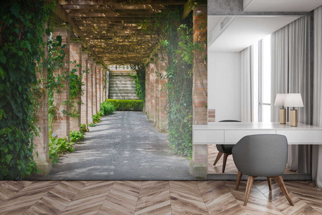 Walkway with stone pillars and vines