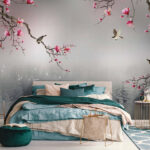 Papel de parede Ramos de árvores com flores cor-de-rosa e pássaros a voar sobre a água