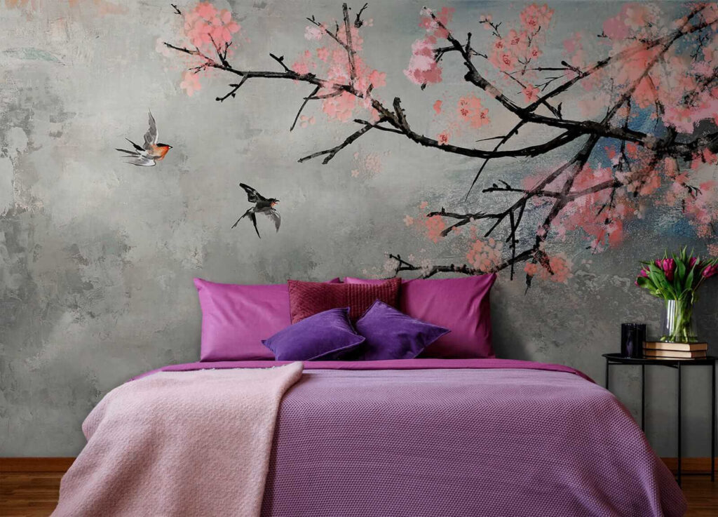 Tree branch with pink flowers and birds flying Tree branch with pink flowers and birds flying