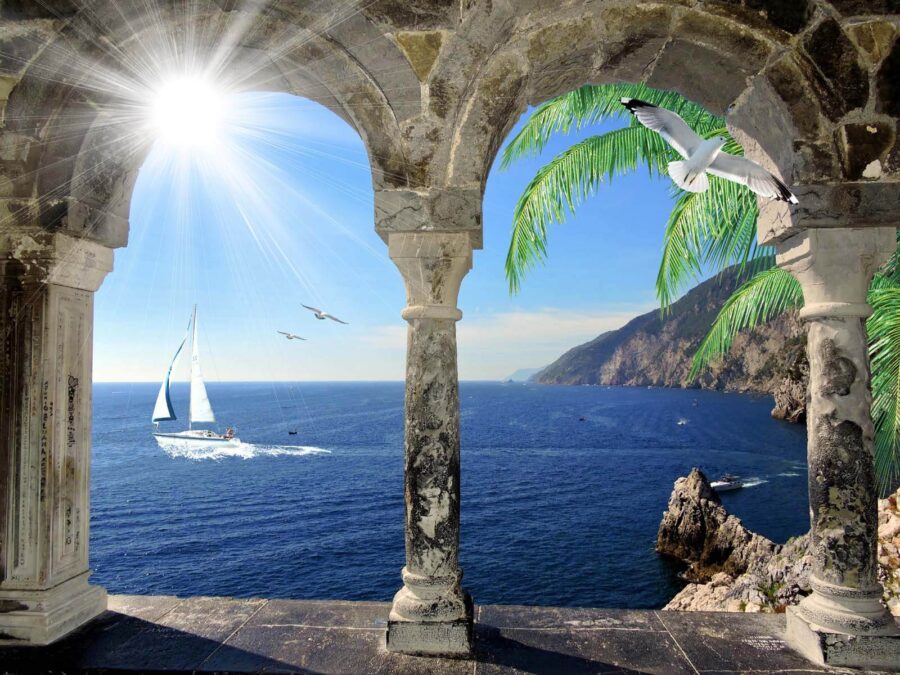 Vista para o oceano a partir de um arco de pedra Vista para o oceano a partir de um arco de pedra