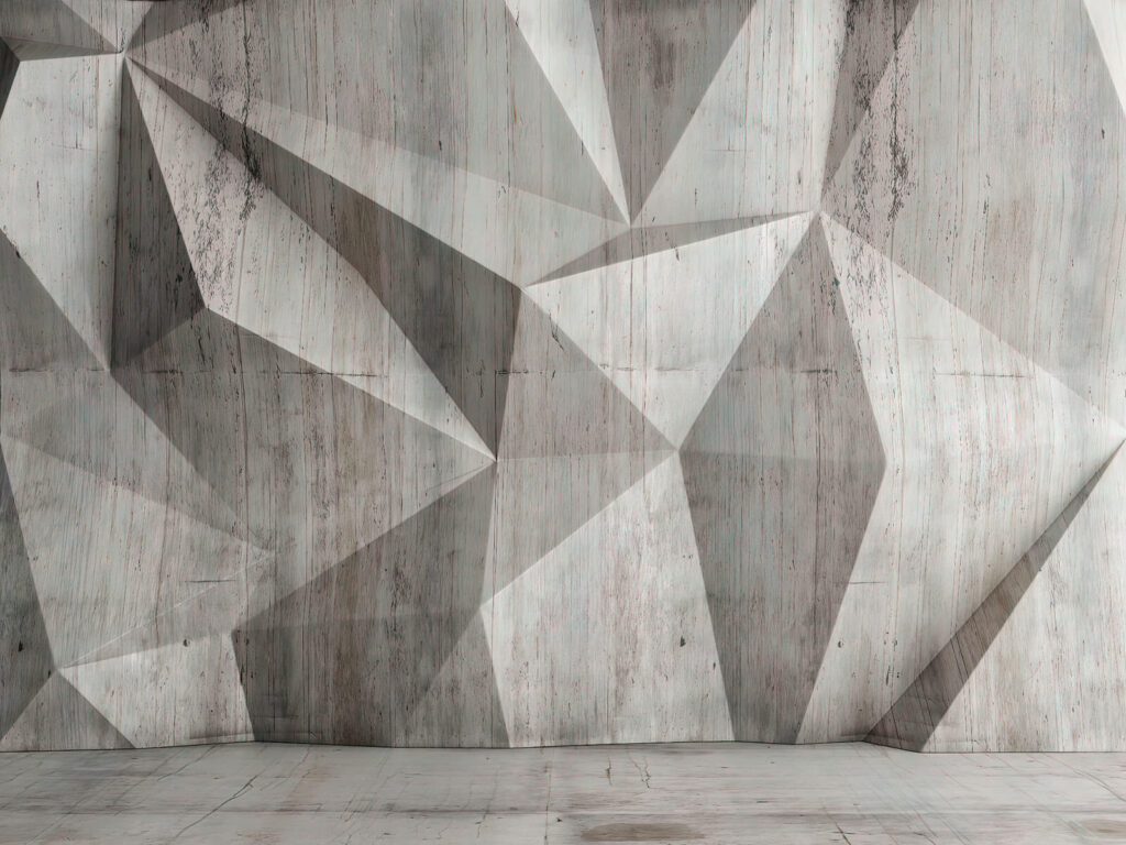 Um muro de betão com um padrão triangular Um muro de betão com um padrão triangular