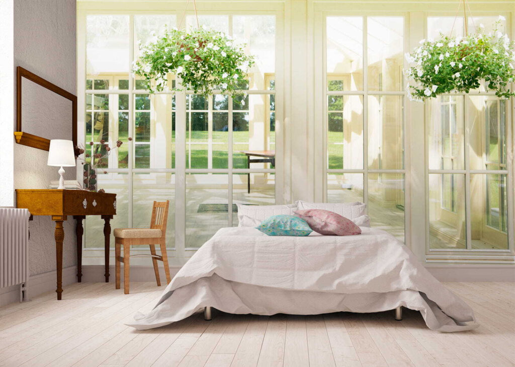 White patio door with glass windows and a potted plant from it White patio door with glass windows and a potted plant from it