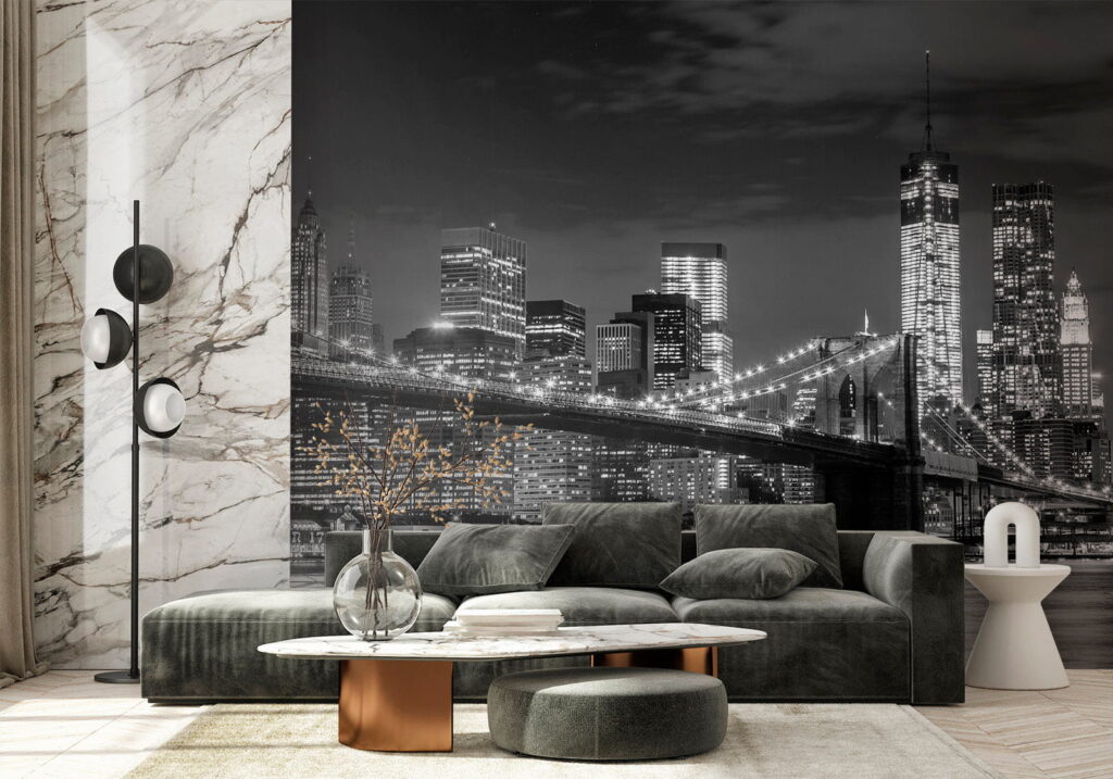 Bridge over water with city skyline at night