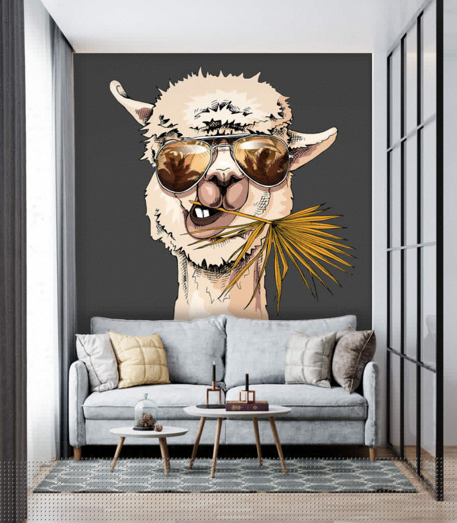 A llama wearing sunglasses and eating a leaf