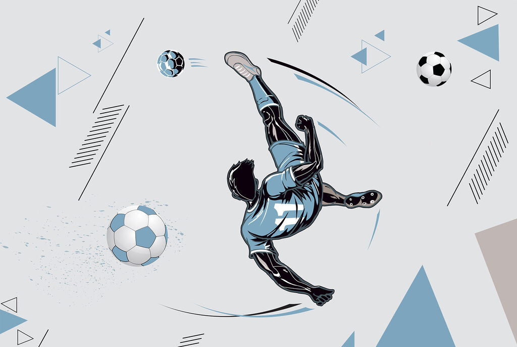 Um jogador de futebol a pontapear uma bola Um jogador de futebol a pontapear uma bola