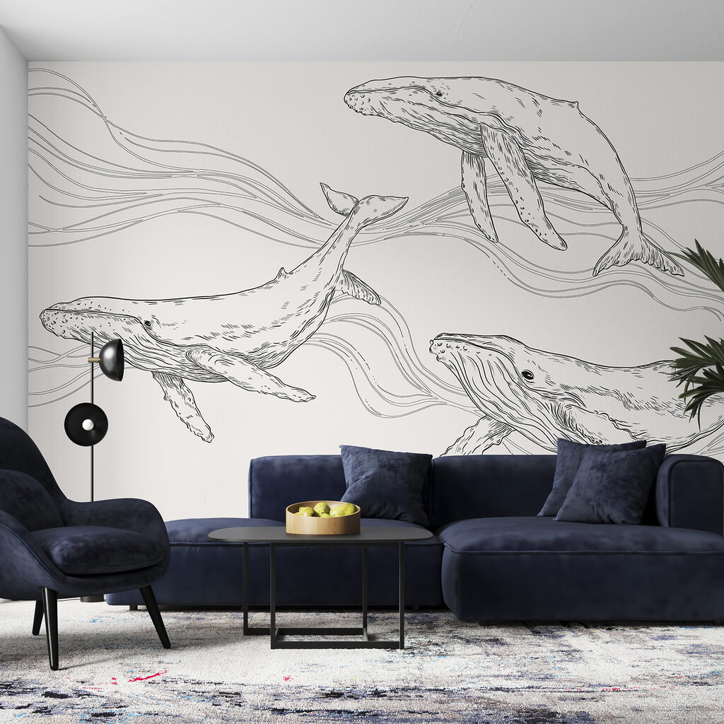 A group of whales swimming in the water