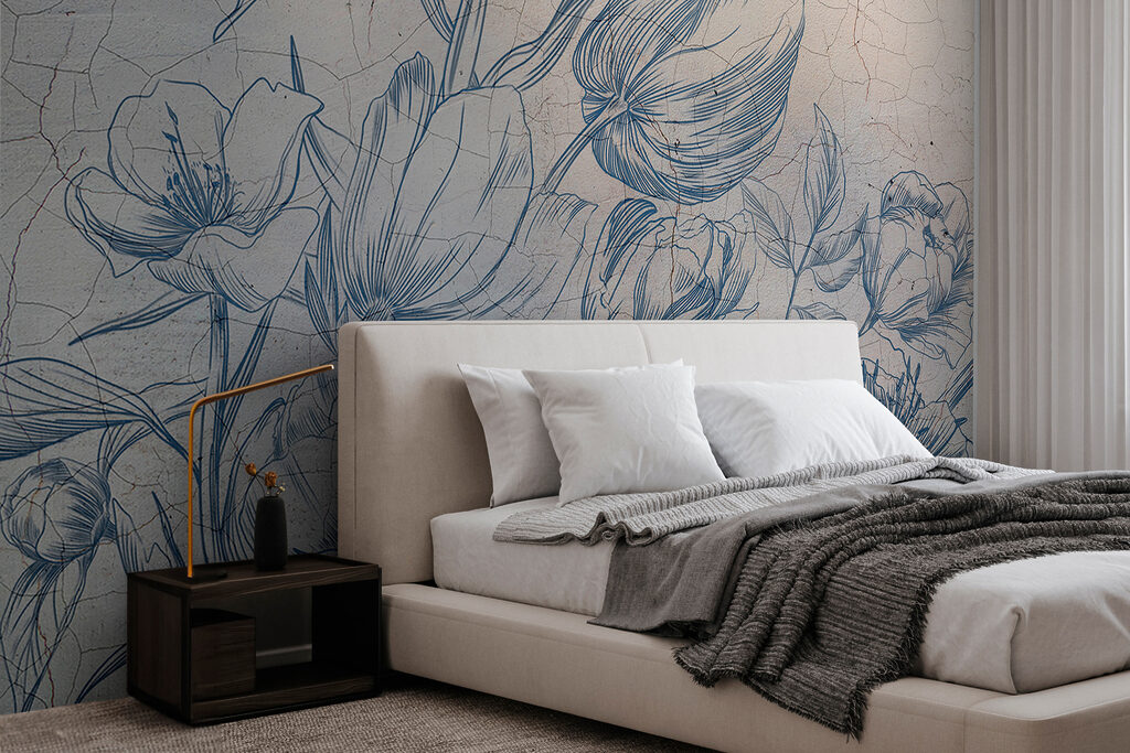 A drawing of flowers on a cracked wall