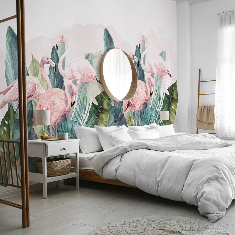 Um grupo de flamingos cor-de-rosa e folhas