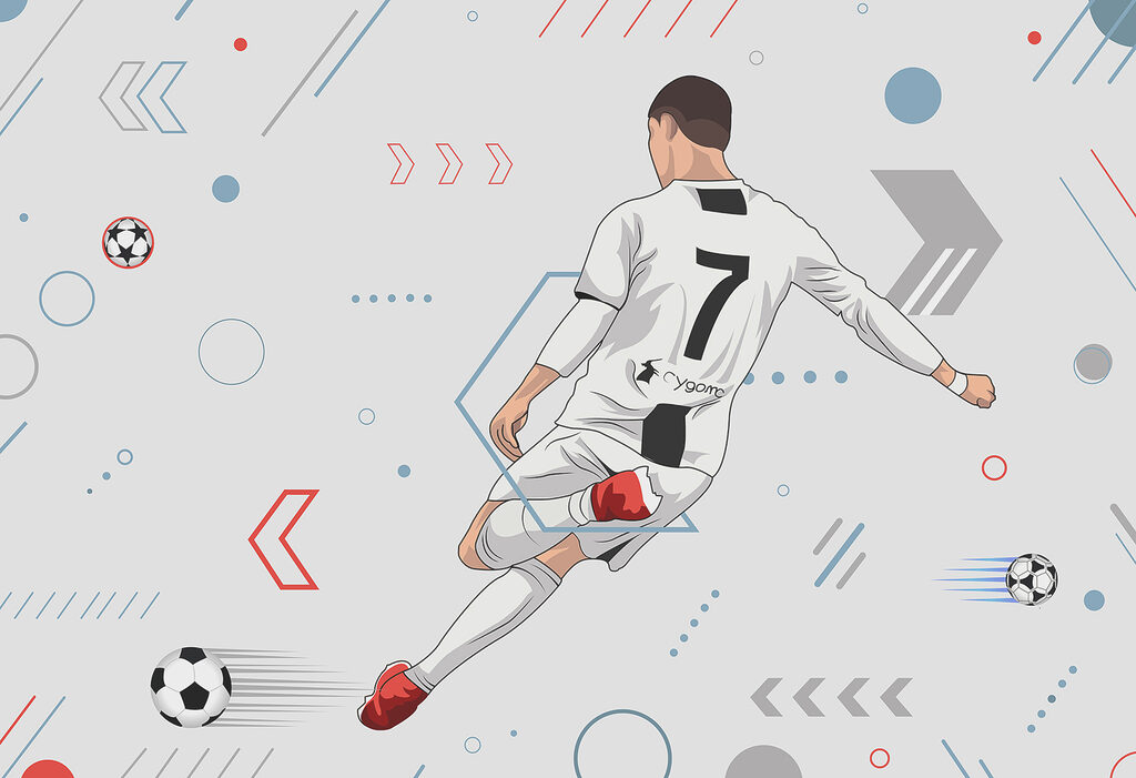 Um jogador de futebol a pontapear uma bola Um jogador de futebol a pontapear uma bola