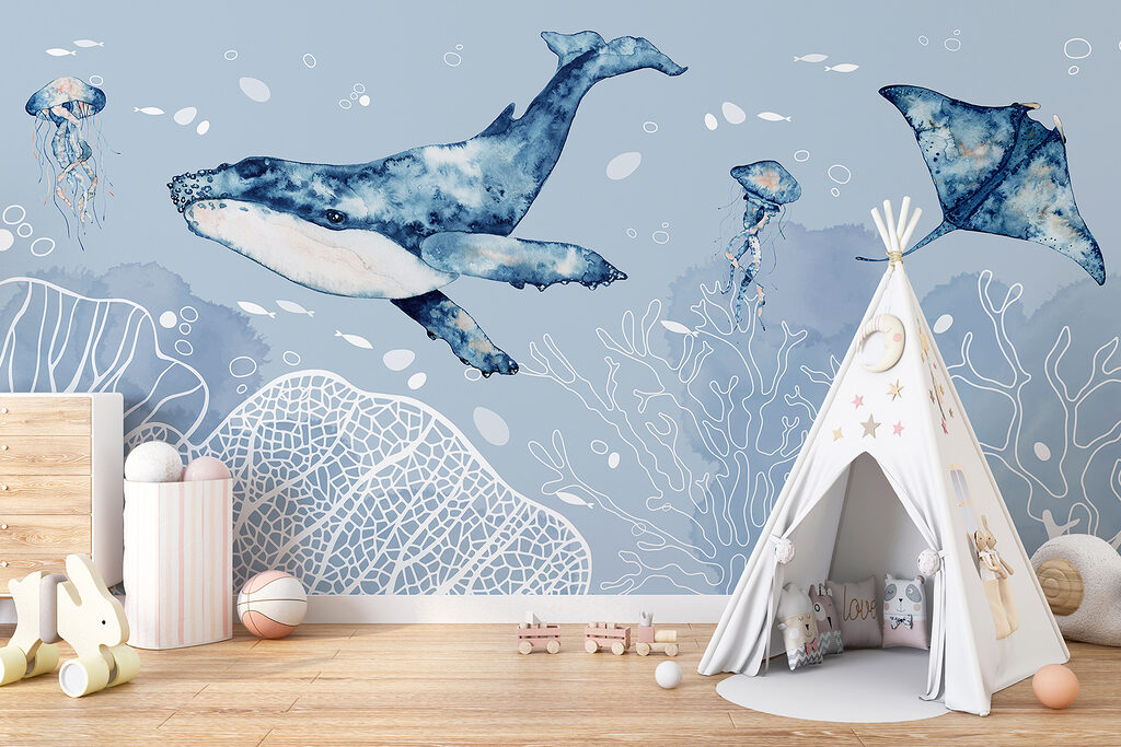 A whale and stingrays swimming in the ocean A whale and stingrays swimming in the ocean