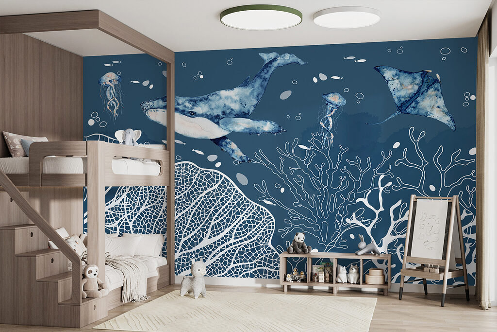 A whale and stingrays swimming in the ocean