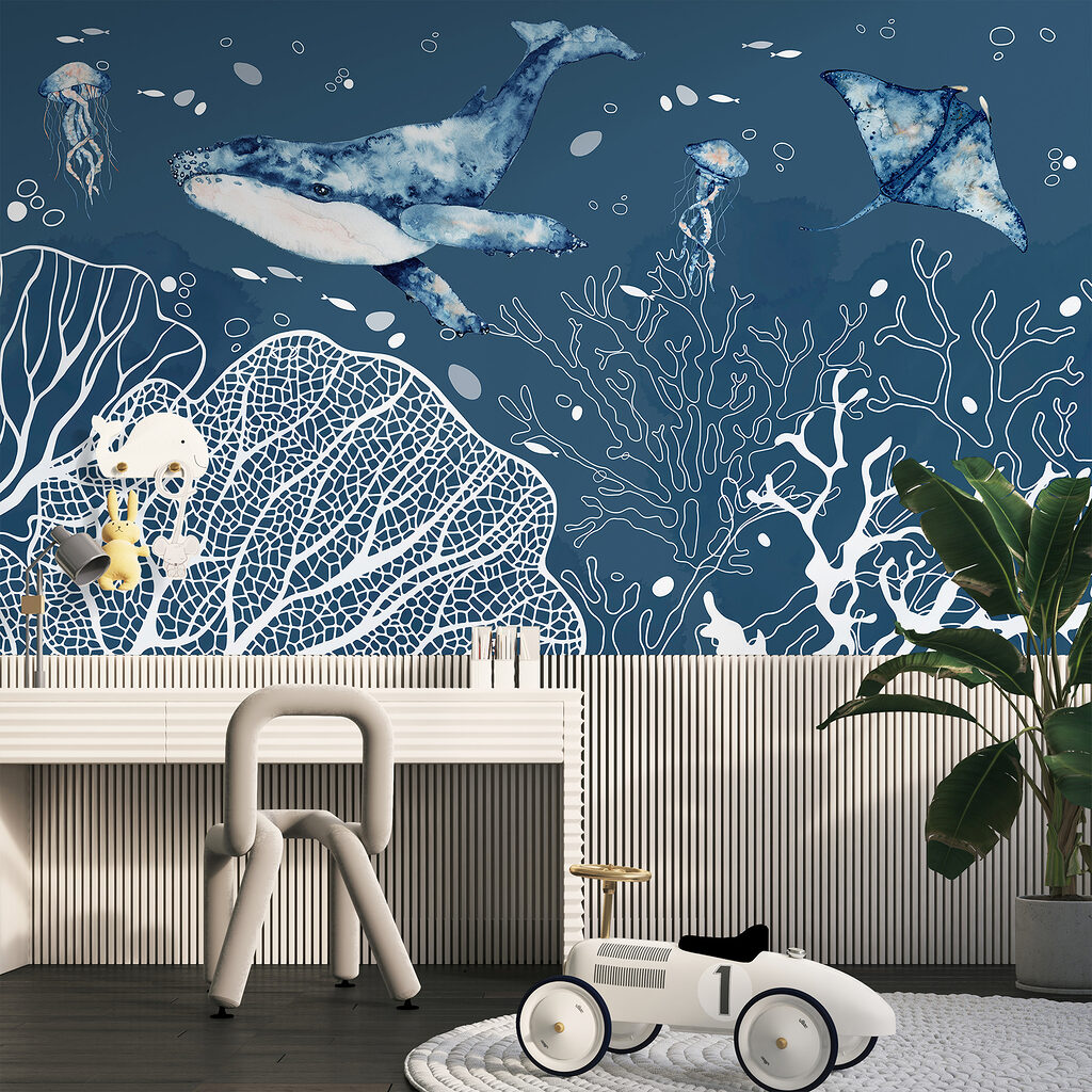 A whale and stingrays swimming in the ocean