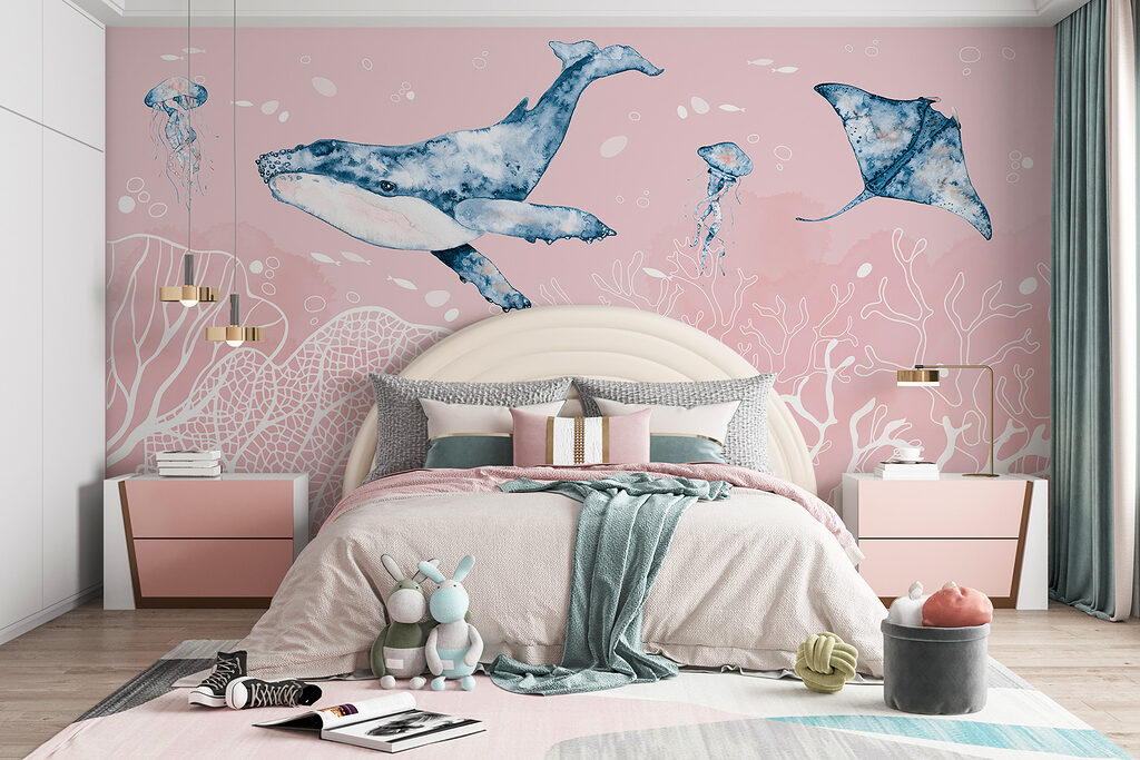 A whale and stingrays swimming in the ocean