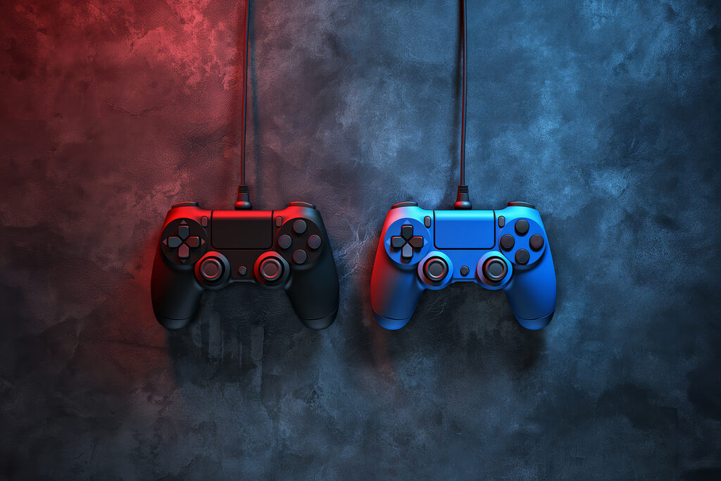 Um comando de videojogos azul e vermelho Um comando de videojogos azul e vermelho