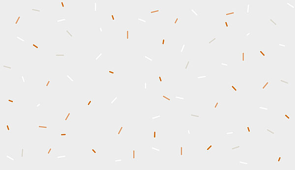 Um granulado branco e laranja sobre um fundo cinzento Um granulado branco e laranja sobre um fundo cinzento