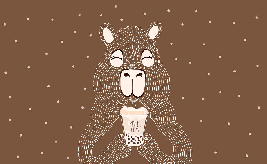 Animal de desenho animado a segurar uma chávena de chá com leite