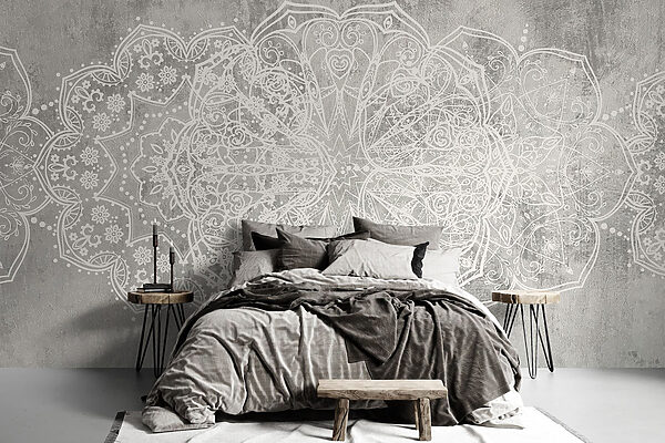 White ornate design on a grey surface