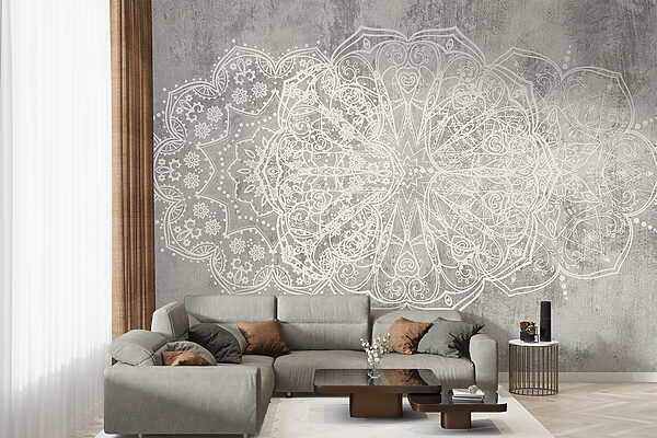 White ornate design on a grey surface