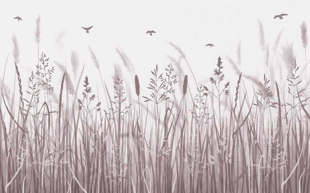 Field of grass with birds flying