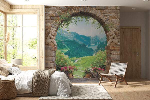 Arco de pedra com estátuas de pedra e vista para um vale e montanhas Arco de pedra com estátuas de pedra e vista para um vale e montanhas