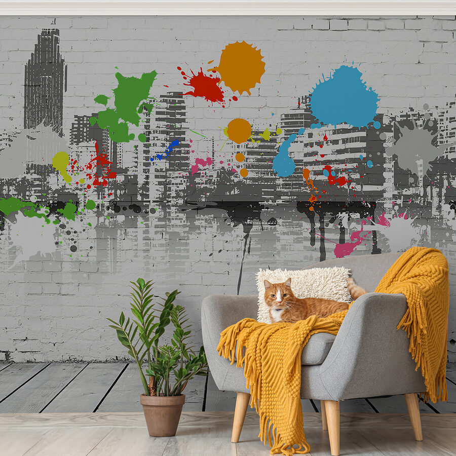 Parede de tijolo branco com salpicos de tinta colorida