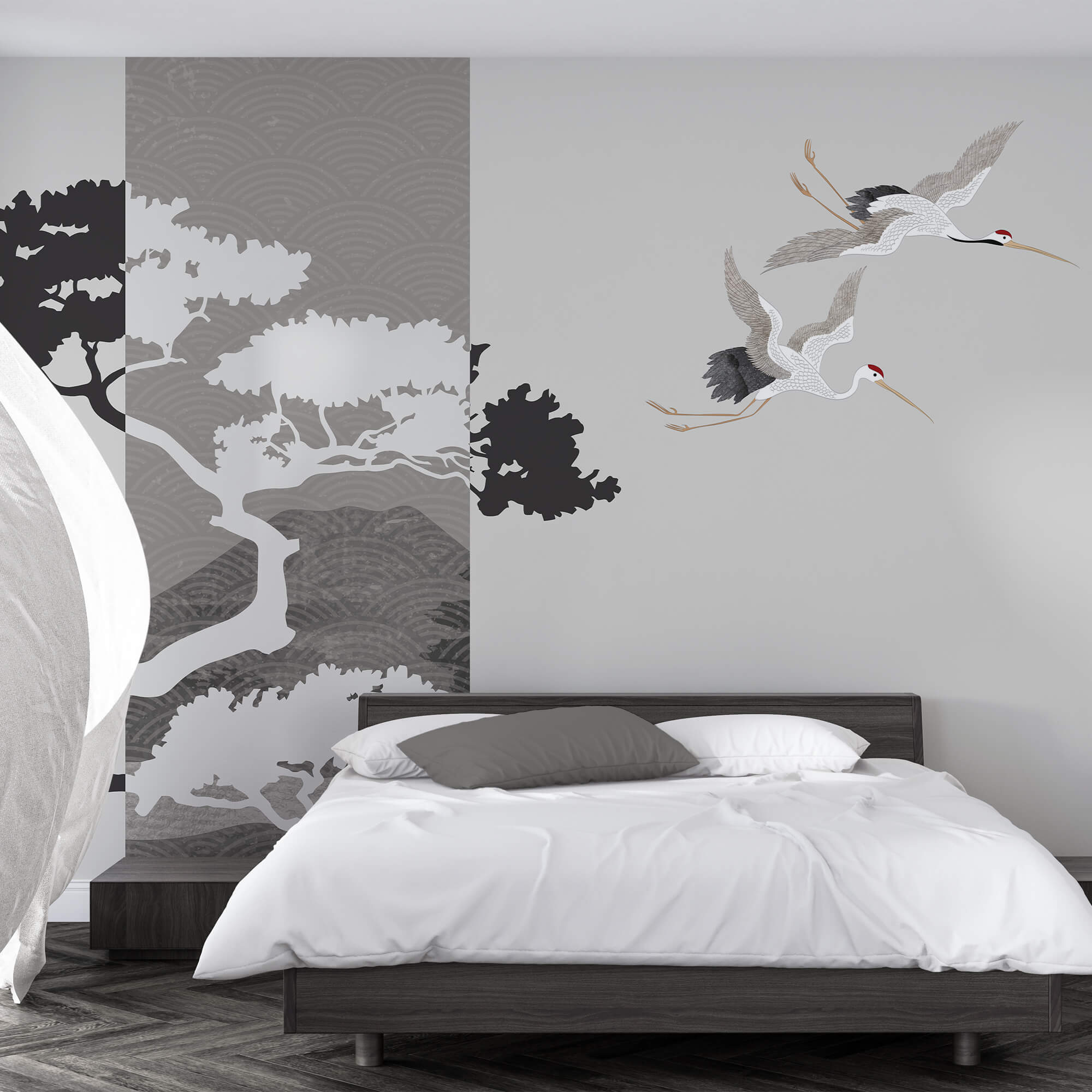 Um par de grous a voar junto a uma árvore