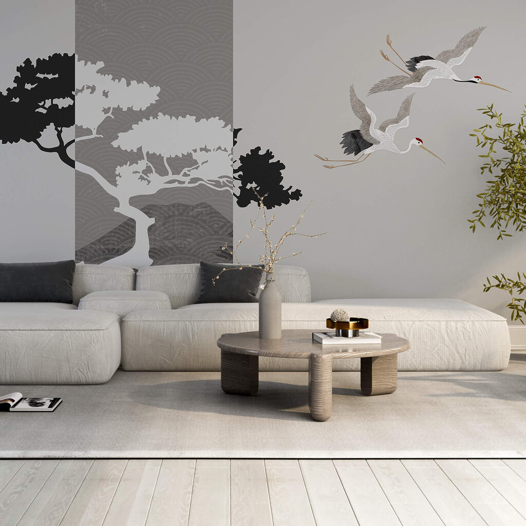 Um par de grous a voar junto a uma árvore