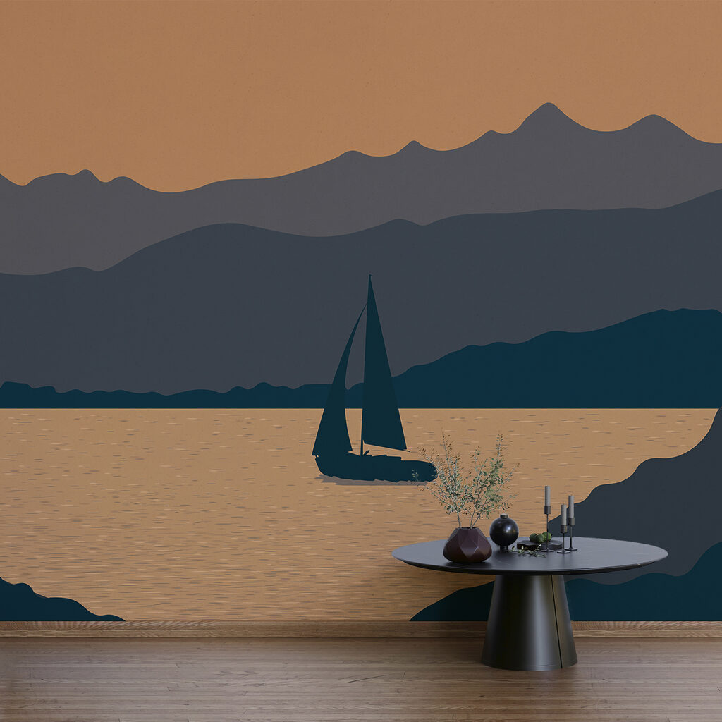 Barco à vela na água com montanhas ao fundo