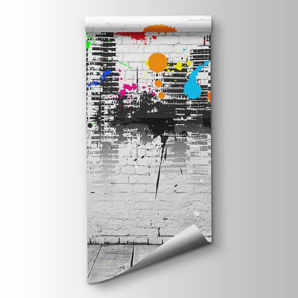 White brick wall with colorful paint splatters