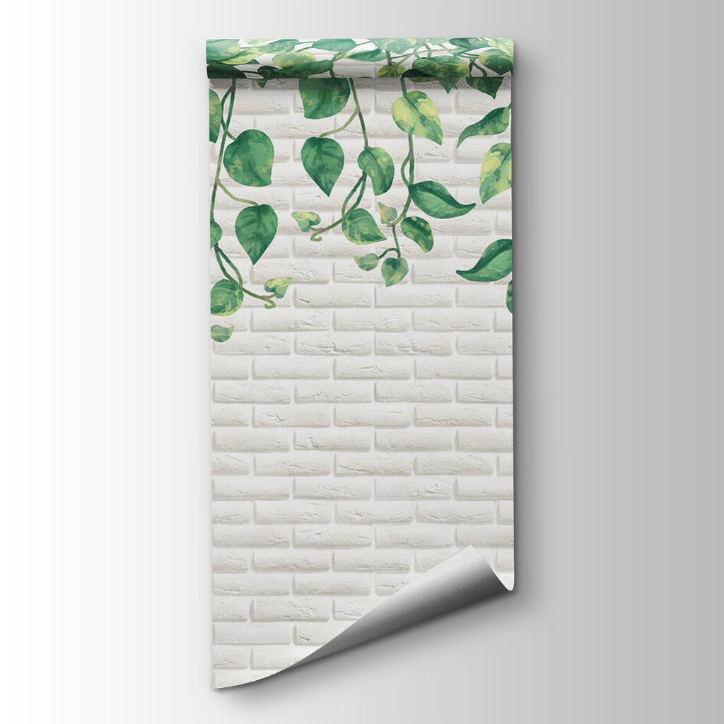 White brick wall with green leaves