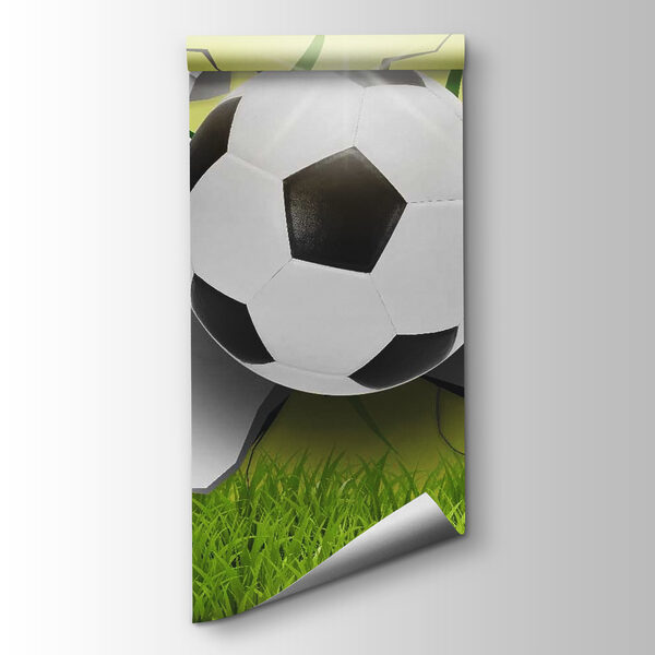 Football ball breaking through a wall