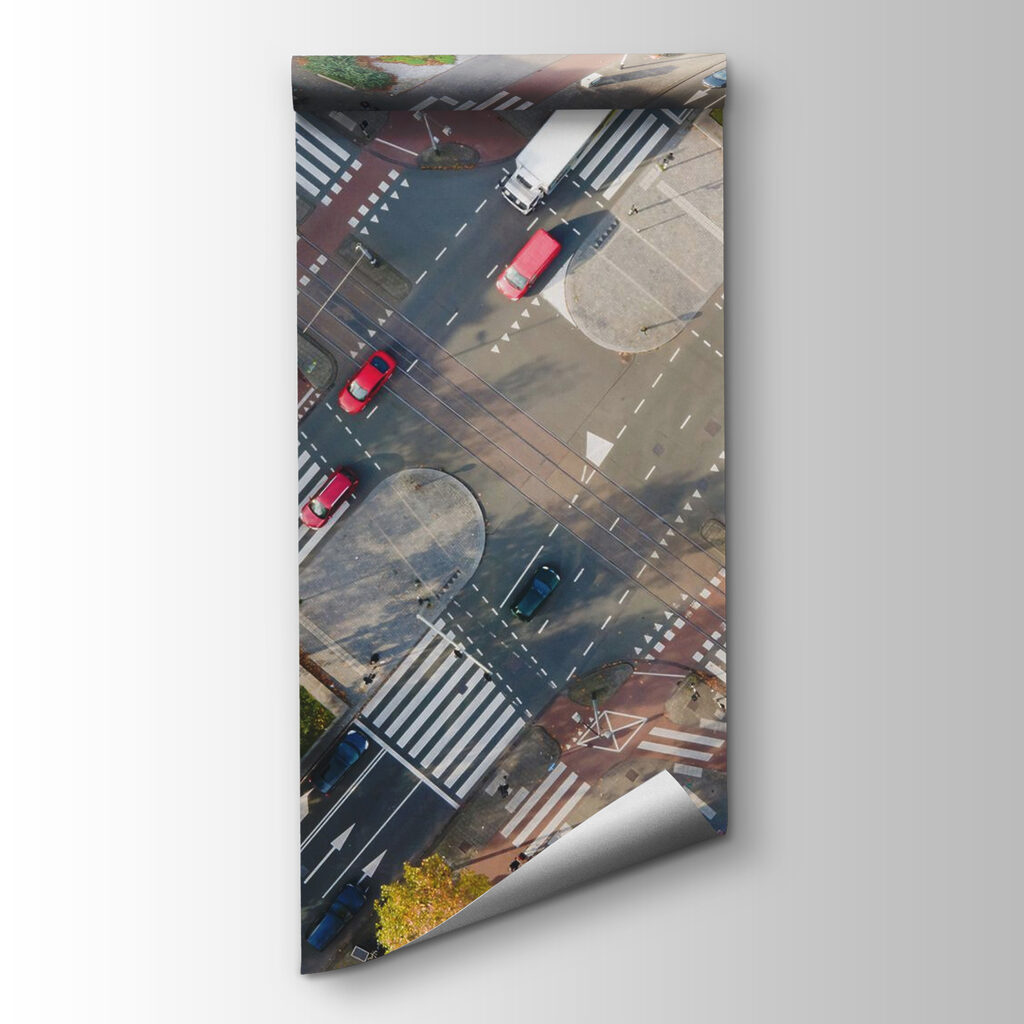 Aerial view of a street intersection with cars and buildings