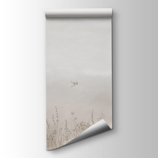 Bird flying over a field of flowers