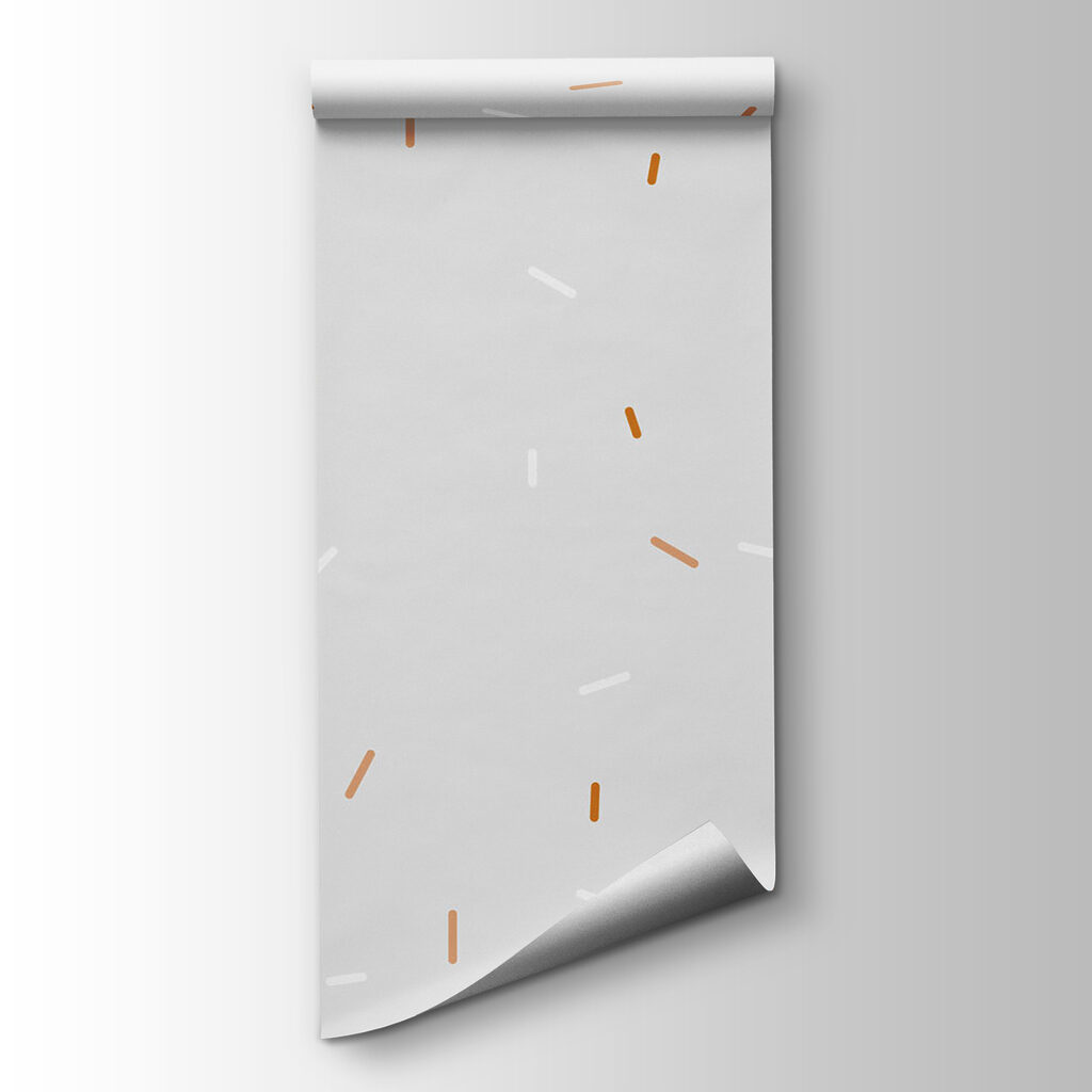 A white and orange sprinkles on a gray background