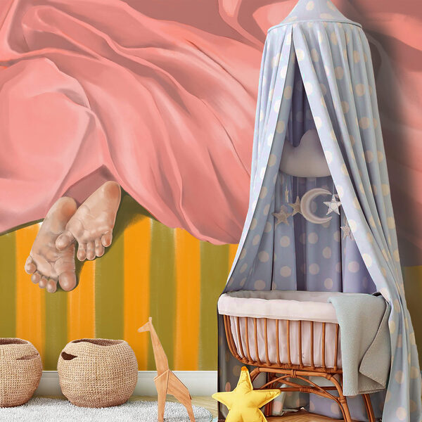 Par de pés debaixo de um cobertor rosa